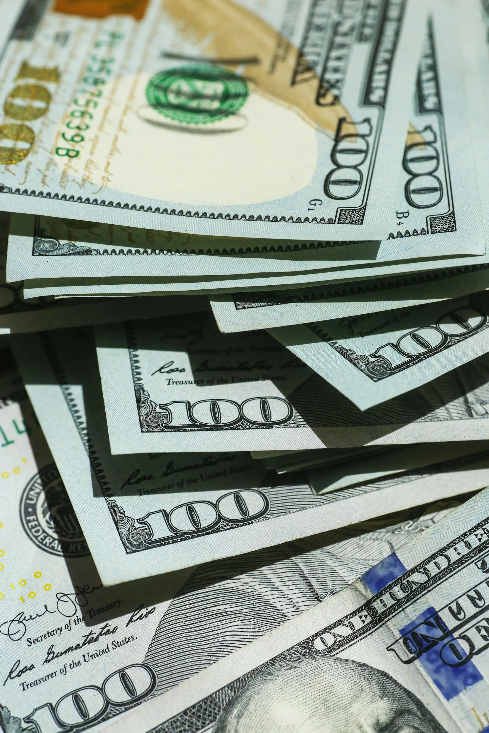 Pile of $100 Dollar Bills